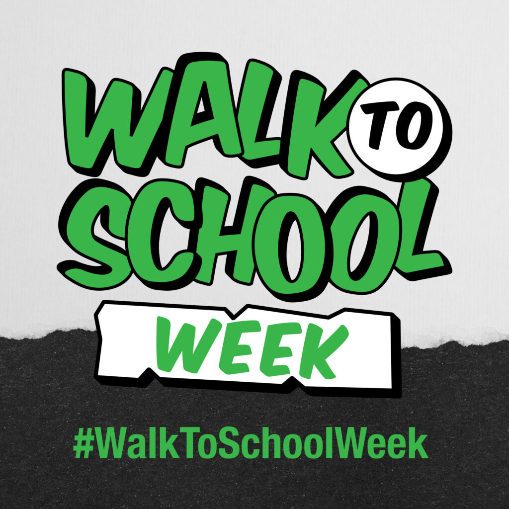 Walk to School Week logo in green comic lettering with the #WalkToSchoolWeek hashtag on a grey and black background