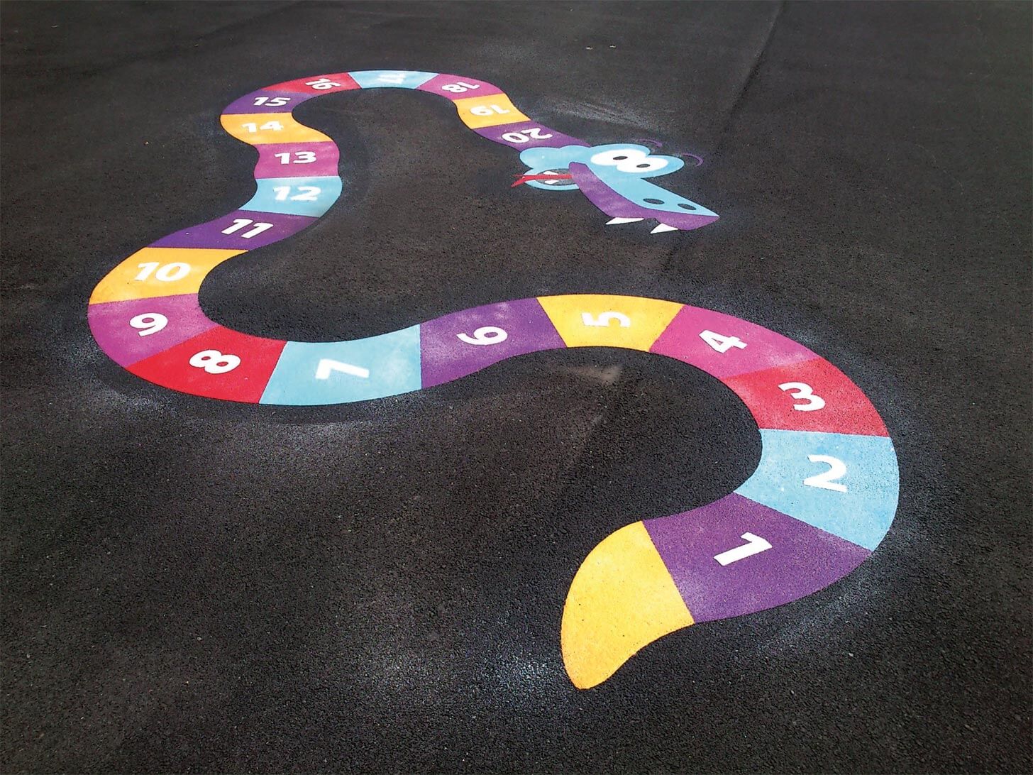 Thermoplastic number snake counting 1 to 20 in purple, blue, red and yellow segments at Berryfields Children's Centre