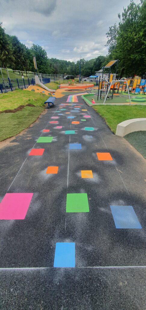 Colourful educational prints and shapes marked across a school playground