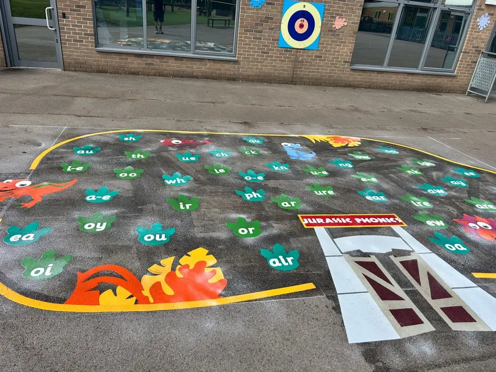 Jurassic Phonics thermoplastic playground marking at a UK school