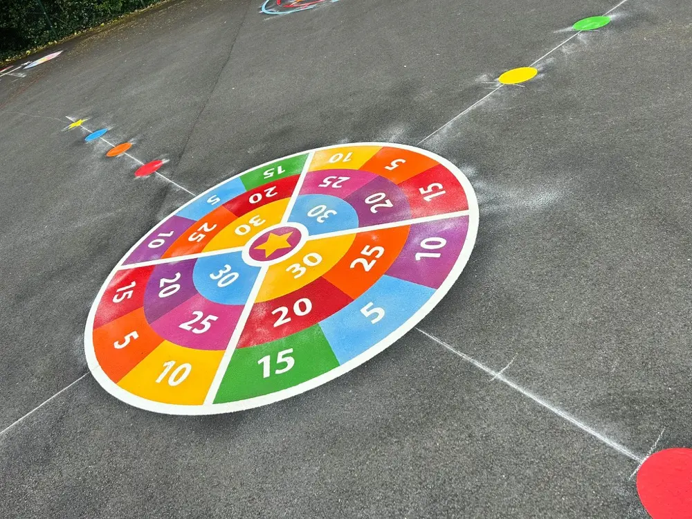 4 Way Shooting Star Target thermoplastic playground marking at a UK school